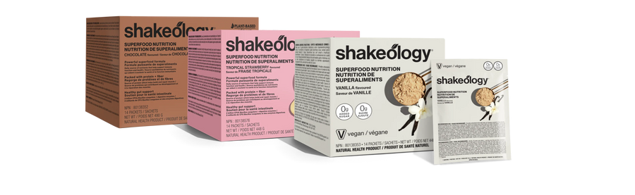 Three Shakeology protein powder pouches in assorted flavors