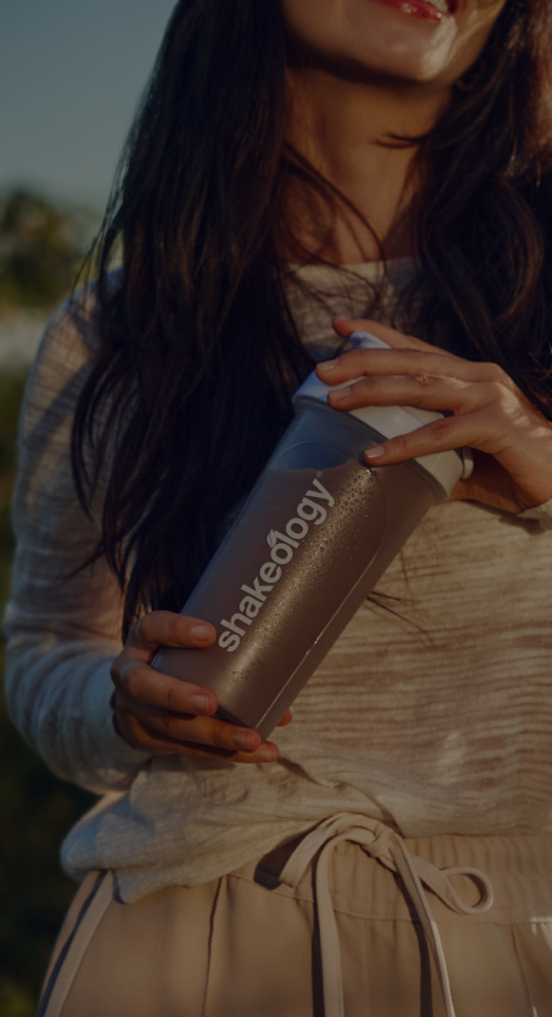 woman holding Shakeology